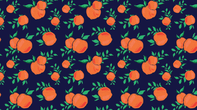 Bright oranges with green leaves set on a dark navy blue background